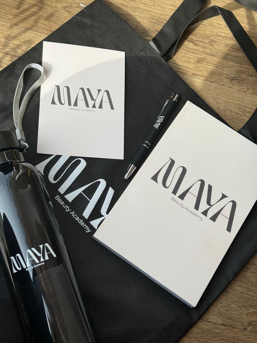 The Maya Beauty Academy student kit: workbook, notebook, pen, water bottle and tote bag