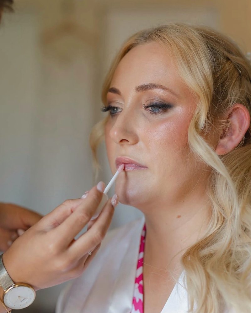 Soft glam makeup with a pale pink lip gloss