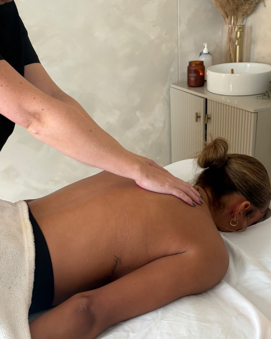 Therapist working on the shoulder during a back, neck and shoulder massage