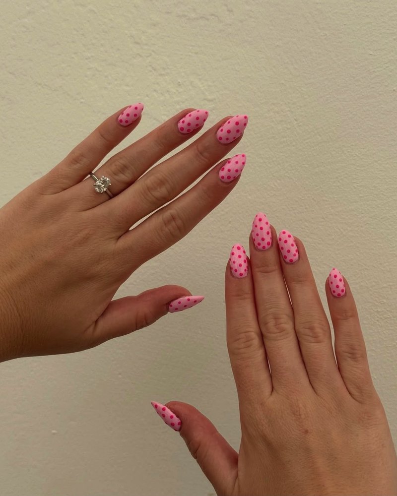 Pink almond nails with hand-painted dots