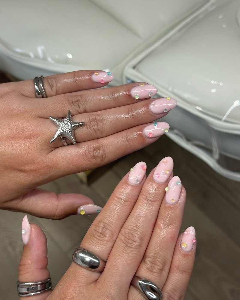 Pale pink nails with pastel jewel details